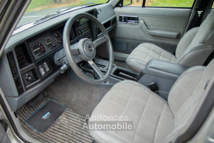 Jeep Cherokee XJ 4.0i Automaat 4X4 - OLDTIMER - SERVO - AIRCO - ELEKTR. RAMEN - <small></small> 19.999 € <small>TTC</small> - #14