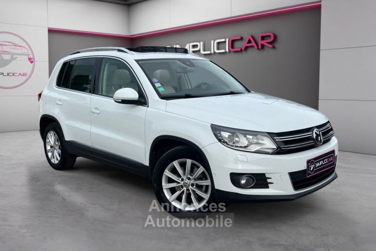 Volkswagen Tiguan 1.4 TSI 160 BlueMotion Technology Carat DSG6 SUIVI COMPLET VW* TOIT PANO OUVRANT* XENONS* SIÈGES ÉLECS CHAUF* GARANTIE - <small></small> 15.900 € <small>TTC</small> - #1