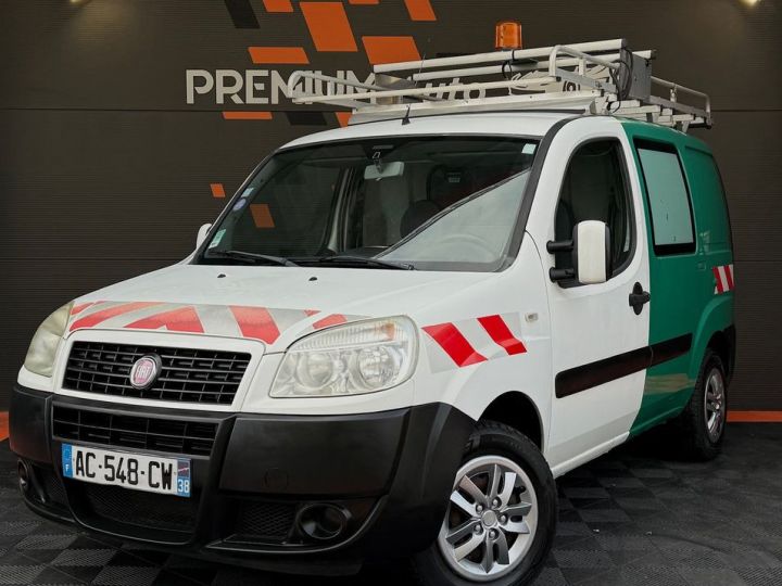 Fiat Doblo 1.3 Multijet 90 Cv Crit'air 1 Galerie de Toit Habillage Bois Rangement Attelage Faible Kilométrage Ok Ct 2027 Blanc - 1